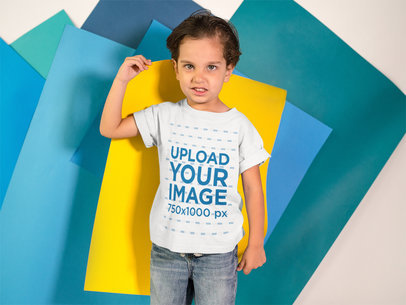 Kid Making an Angry Face While Holding a Yellow Paper on his Back Wears a T-Shirt Mockup
