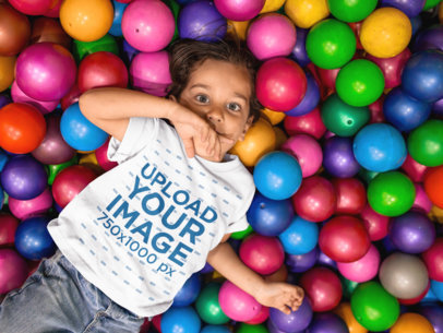 Young Kid at the Ball Pit Wearing a Round Neck Tee Mockup a16149