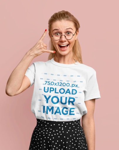 Round-Neck Tee Mockup of a Woman with Glasses Making a Rock Hand Gesture