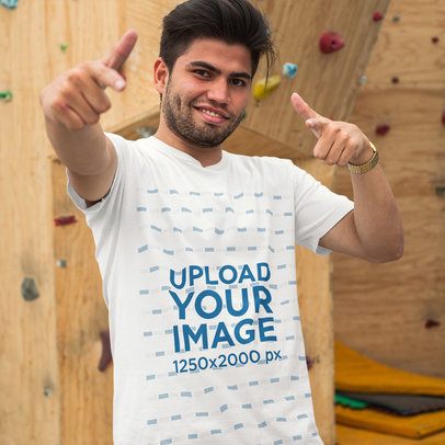 Mockup of a Cool Guy Wearing a T-Shirt While Near a Climbing Wall