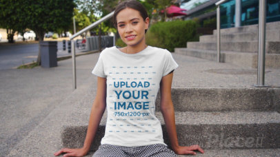 T-Shirt Video of a Young Woman Posing on Some Steps