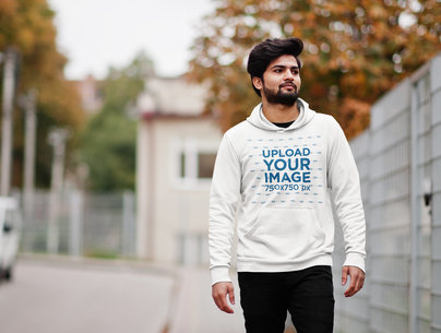 Pullover Hoodie Mockup Featuring a Bearded Man Walking by the Street