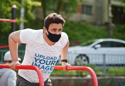 V-Neck Tee Mockup of a Man Doing Dips at a Park