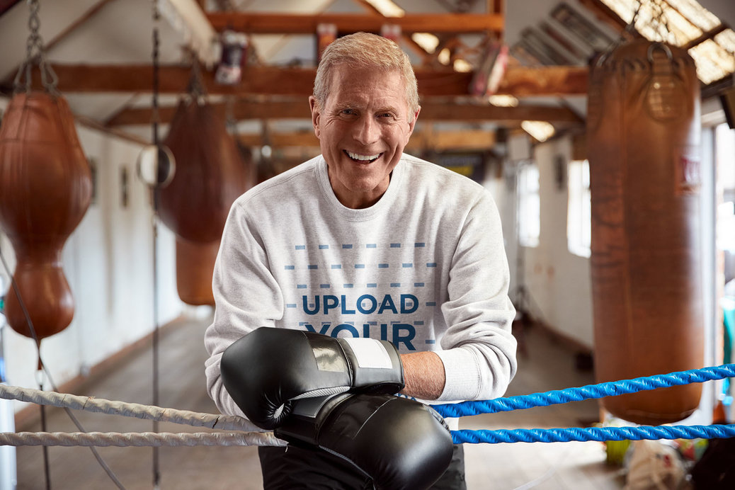 Sweatshirt Mockup Featuring a Senior Man at a Boxing Gym 