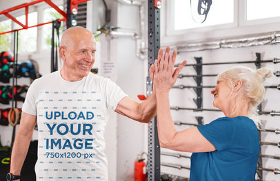 Round-Neck Tee Mockup Featuring a Senior Couple High-Fiving Each Other