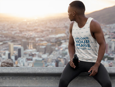 Heathered Tank Top Mockup Featuring an Athletic Man Sitting on a Ledge