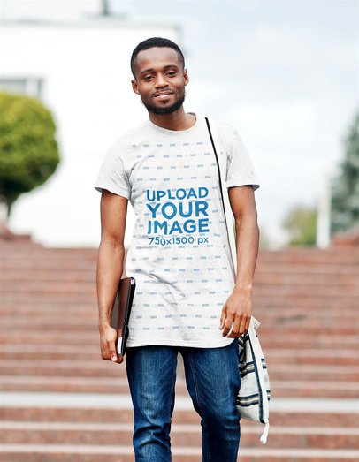 Heathered Round-Neck T-Shirt Mockup of a Smiling Man Walking on a College Campus