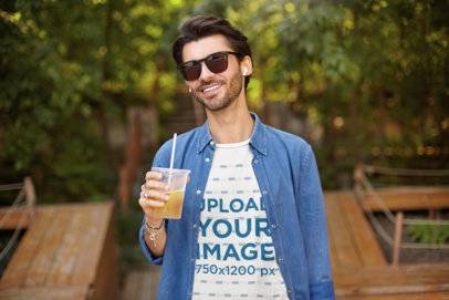 T-Shirt Mockup of a Man With Sunglasses Holding an Iced Tea 