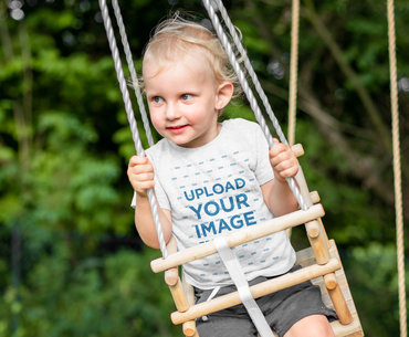 Heathered T-Shirt Mockup Featuring a Little Girl on a Swing