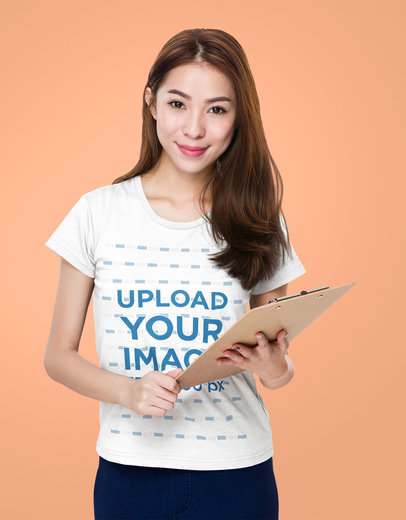 T-Shirt Mockup Featuring a Happy Woman Holding a Clipboard m7344-r-el2