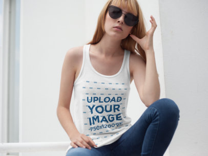 Woman Wearing a Bella Canvas Tank Top Mockup and Sunglasses in a White Room