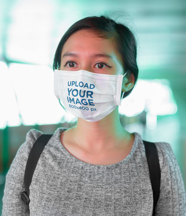 Face Mask Mockup of a Young Woman on the Street at Night