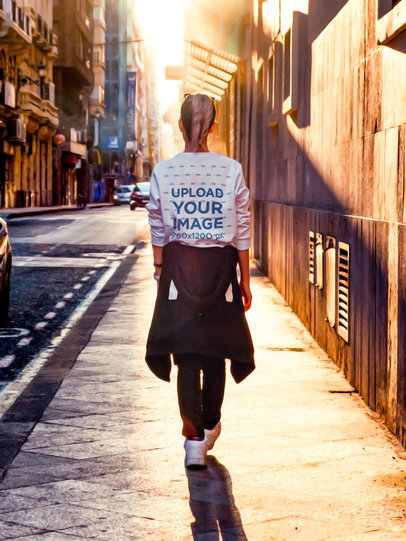 Back-View Sweatshirt Mockup of a Woman Walking by a Lonely Street m5171-r-el2