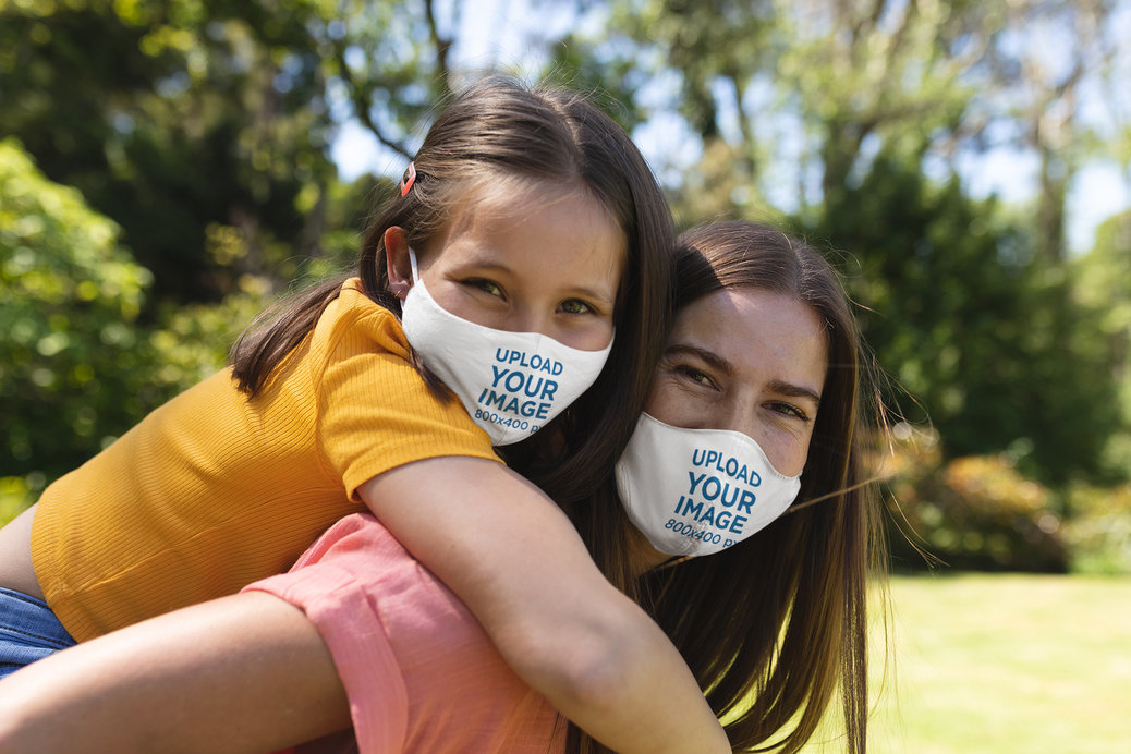 Face Mask Mockup Featuring Mother and Daughter Playing Together
