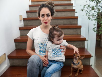 Pretty Mom and Her Baby Girl Wearing Different T-Shirts Mockup While in Wooden Stairways with a Dog 16087
