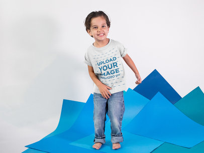 Happy Kid at a Studio Wearing a T-Shirt Mockup