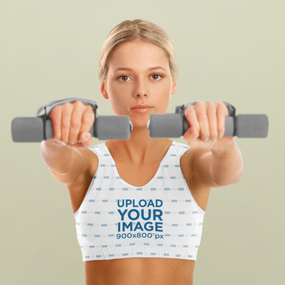 Sports Bra Mockup of a Serious Fitness Woman Lifting Weights
