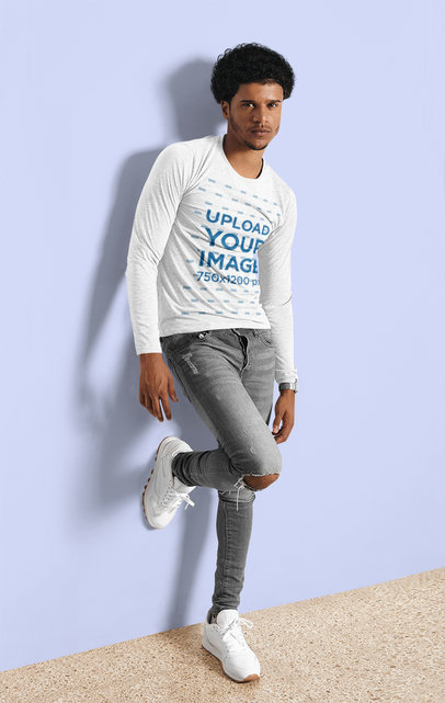 Heathered Long Sleeve Tee Mockup of a Man Posing by a Wall