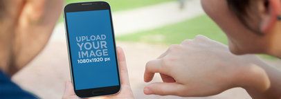 Mockup of Two Women Hanging Out Using Samsung Galaxy S4