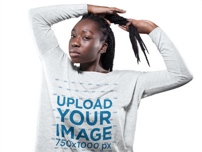 Woman with Locks Wearing a Bella Canvas Heather Long Sleeve Tee Template While Against a Solid Background