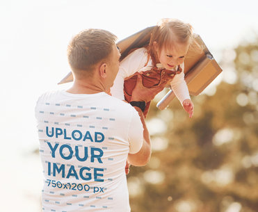 Back-View Tee Mockup of a Happy Father Playing with His Daughter
