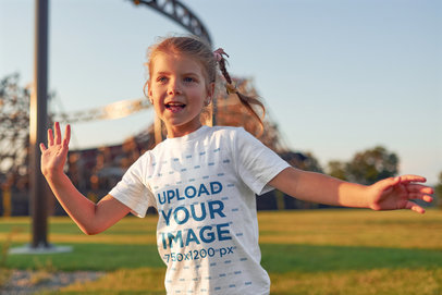 Round-Neck T-Shirt Mockup of a Little Girl Playing