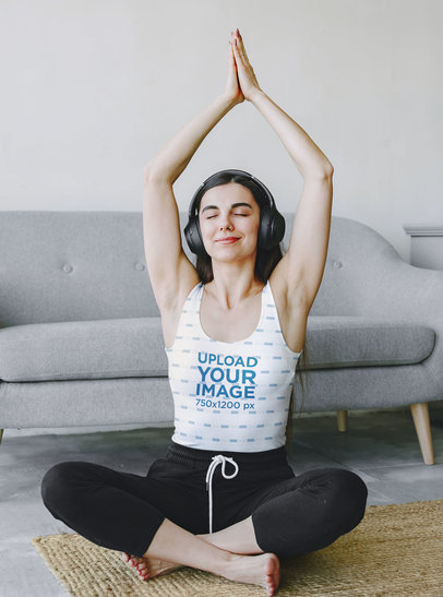 Tank Top Mockup of a Calm Woman Practicing Yoga at Home