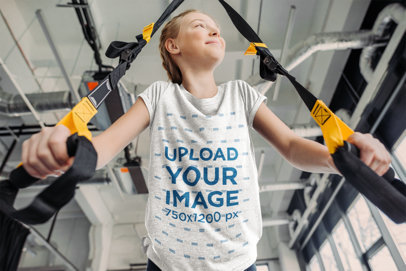 Heathered Tee Mockup of a Girl Using Training Straps at a Gym m6136-r-el2