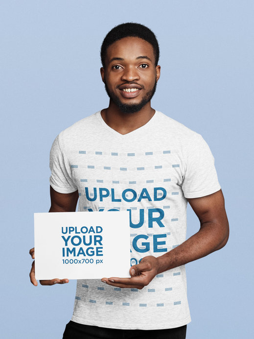 V-Neck Tee Mockup of a Man Holding an A4 Flyer