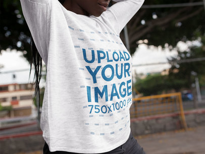 Cropped Face Woman with Locs Wearing a Round Neck Long Sleeve Tee Mockup While Outdoors