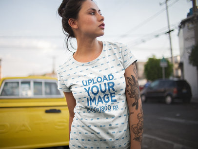 Beautiful Woman Wearing a Sublimated Tshirt Template While in an Urban Area