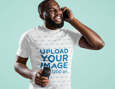 T-Shirt Mockup of a Man Talking on the Phone in a Studio
