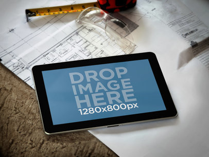 Mockup of a Galaxy Tablet on an Architect's Desk