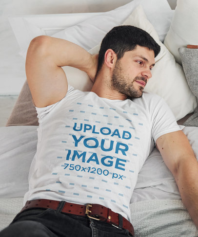 Round-Neck Tee Mockup of a Man with a Beard Lying on His Bed