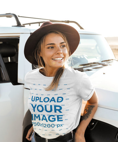 Round-Neck Tee Mockup with an Arm Tattoo Leaning on a Truck