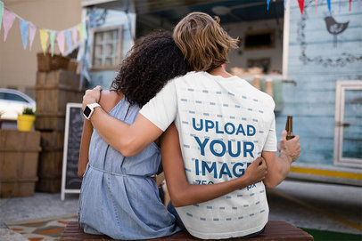 Back-View T-Shirt Mockup of a Man Chilling With His Girlfriend