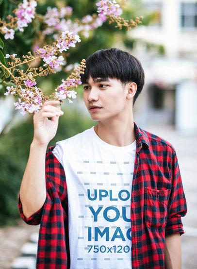 Round-Neck T-Shirt Mockup Featuring a Man Holding a Flower