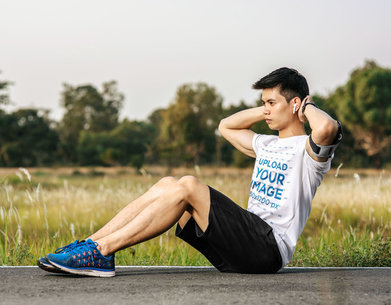 T-Shirt Mockup of a Man Doing Crunches Outdoors m4749 r-el2
