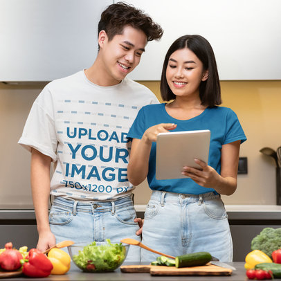 T-Shirt Mockup Featuring a Happy Young Man Cooking With His Girlfriend 