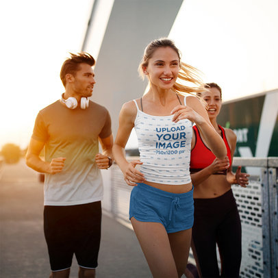 Spaghetti Strap Tank Top Mockup Featuring a Happy Woman Jogging With Her Friends 