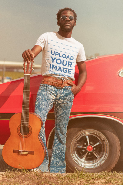 T-Shirt Mockup of a Man with His Guitar Posing by a Classic Car