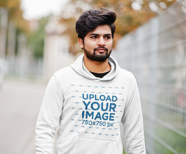 Mockup of a Bearded Man Walking on a Street with a Pullover Hoodie