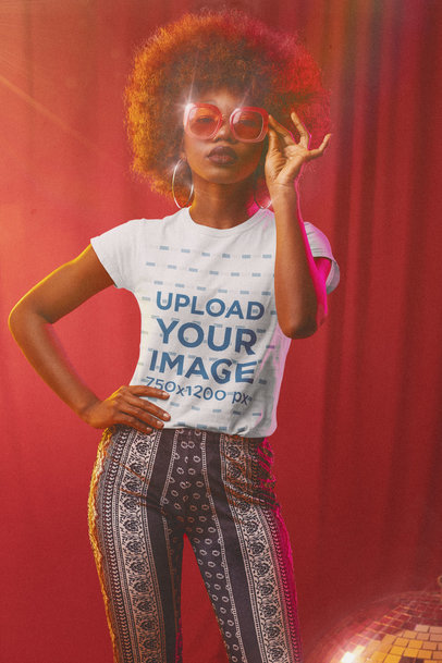 T-Shirt Mockup Featuring a Woman in a 70s Outfit 