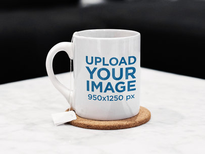 Mockup of a Mug Lying Over a White Surface with a Tea Bag Inside m8744-r-el2