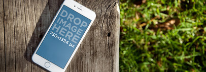 Mockup of an iPhone 6 on a Wooden Bench