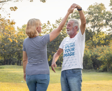 Tee Mockup of an Elderly Man Dancing with His Wife at a Park m9827 r-el2