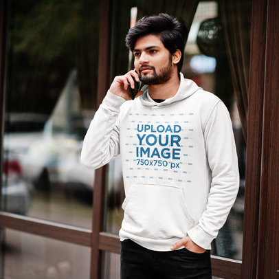Pullover Hoodie Mockup Featuring a Bearded Man Talking on the Phone