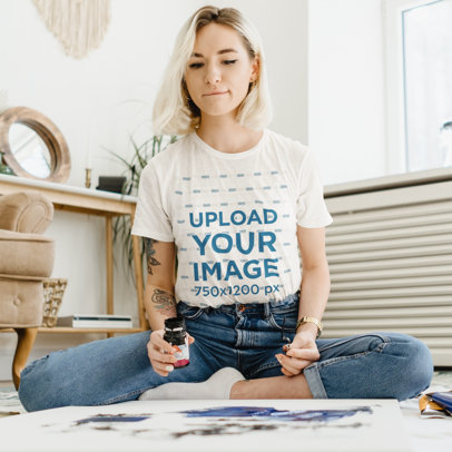 Round-Neck T-Shirt Mockup of a Tattooed Woman Painting