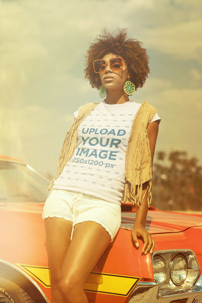 T-Shirt Mockup Featuring a Woman in a 70s Style Outfit Posing by a Car 