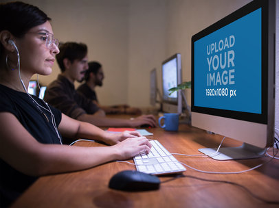 iMac Mockup Being Used by a Woman at the Office